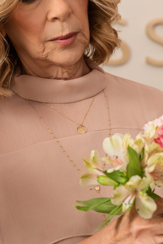 Cadena con dije en forma de angel en oro 14k